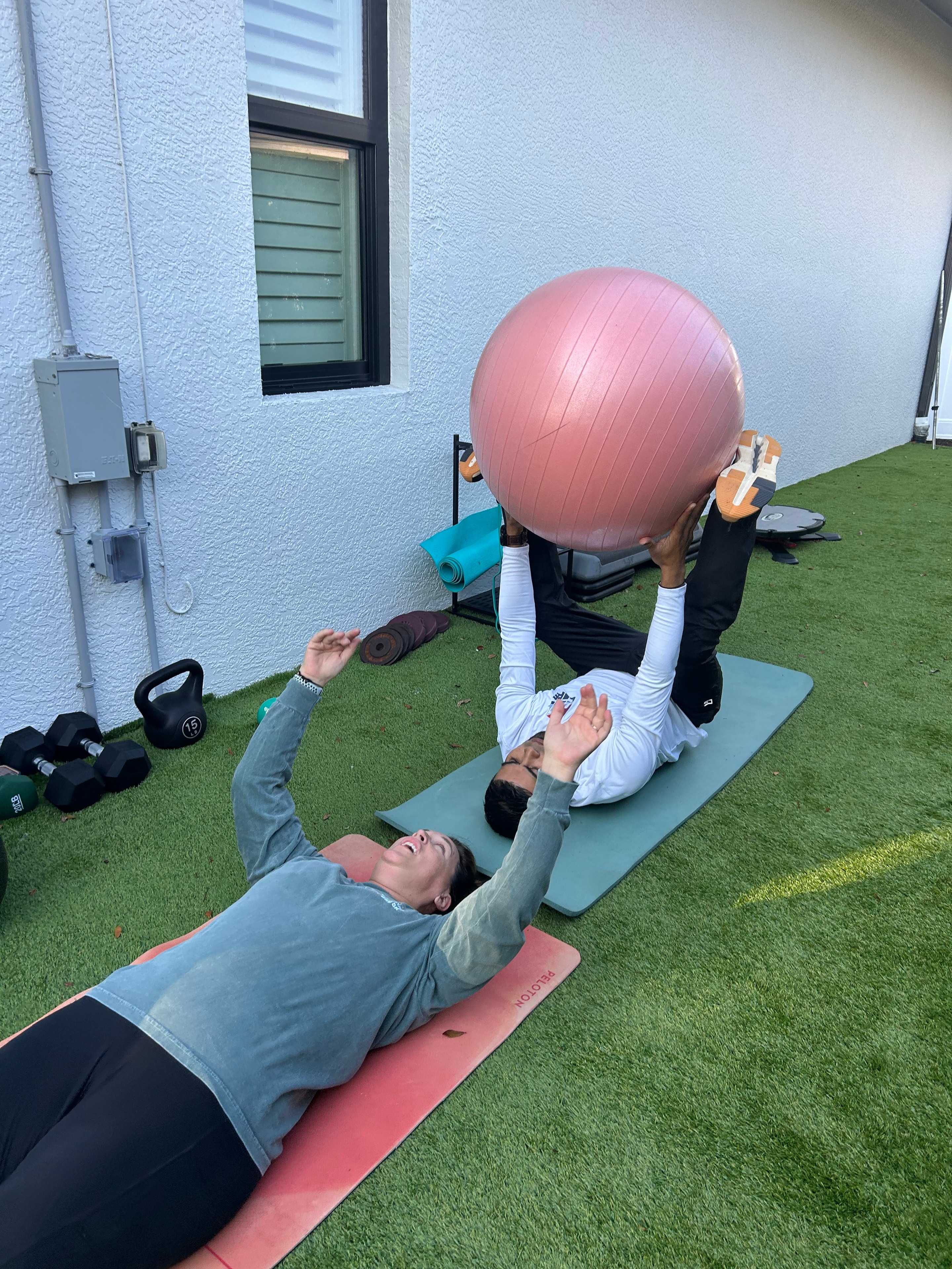 Personal trainer coaching a client outdoors