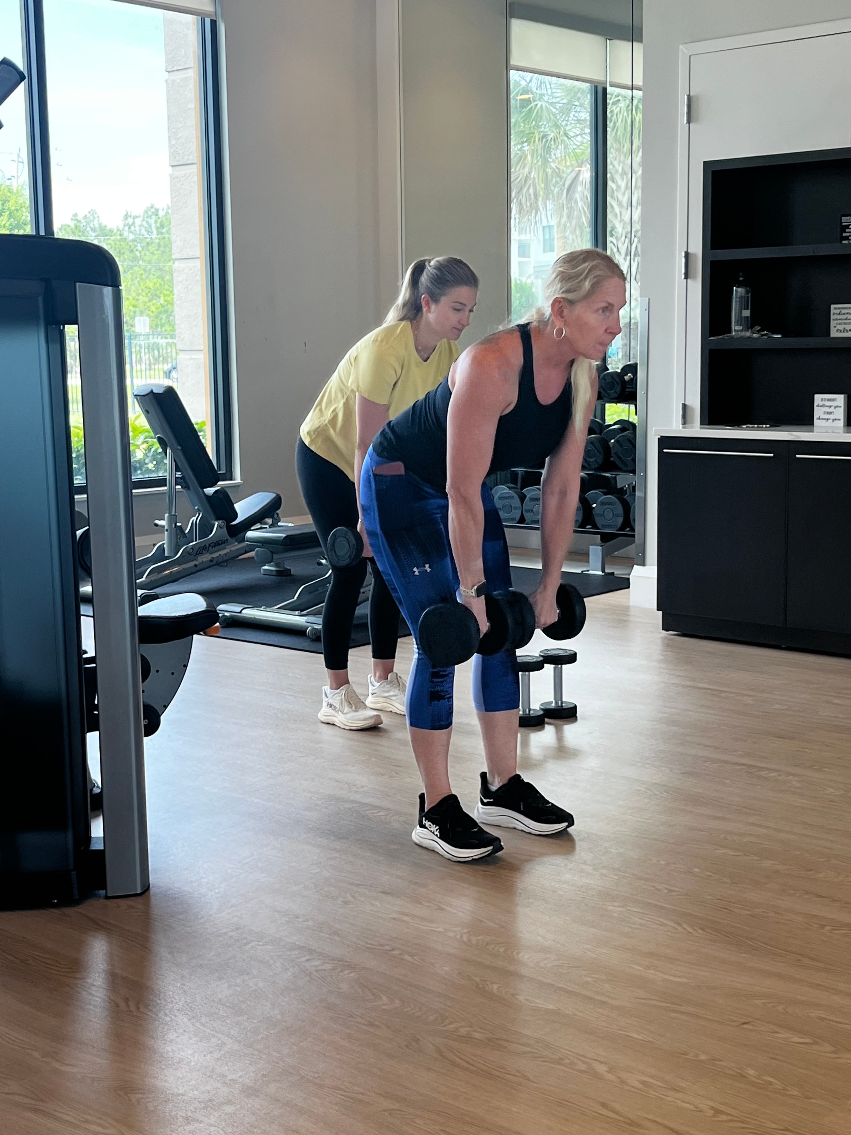 Personal trainer coaching a client one-on-one